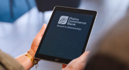 Person holding a tablet with the PCB app