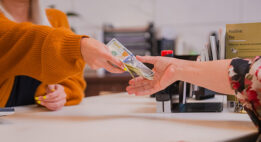 Woman handing over cash