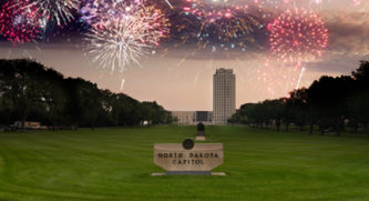 North Dakota Capitol In Bismarck With Fireworks