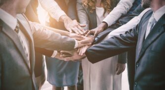 Business People In Huddle