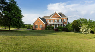 Large house with a large lawn in front