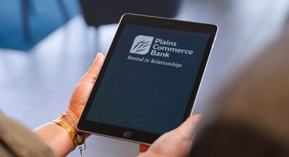 Person holding a tablet with the PCB app